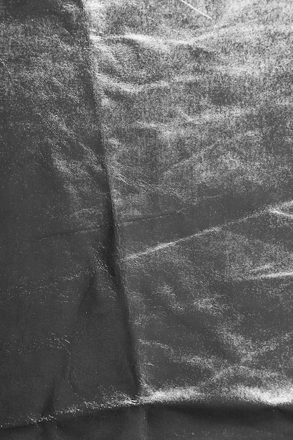 Zdjęcie srebrna tekstura tkaniny o nierównej, pomarszczonej powierzchni