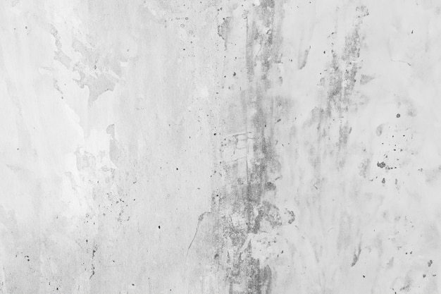 Stara betonowa ściana z szarym tłem.