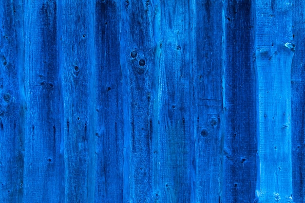 Zdjęcie stara drewniana ściana pokryta niebieskim tłem farby