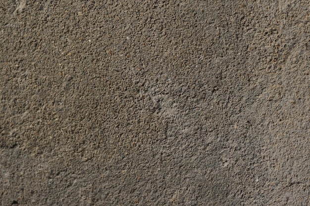 stara nierówna betonowa ściana w formie tła