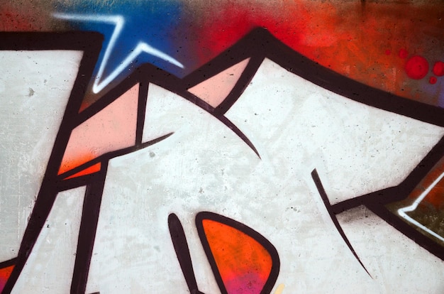 Stara ściana pomalowana na kolor graffiti rysunek czerwonymi farbami w aerozolu Obraz tła na temat rysowania graffiti i sztuki ulicznej