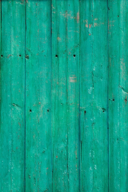 Stara zielona popękana farba na starym drewnianym tle