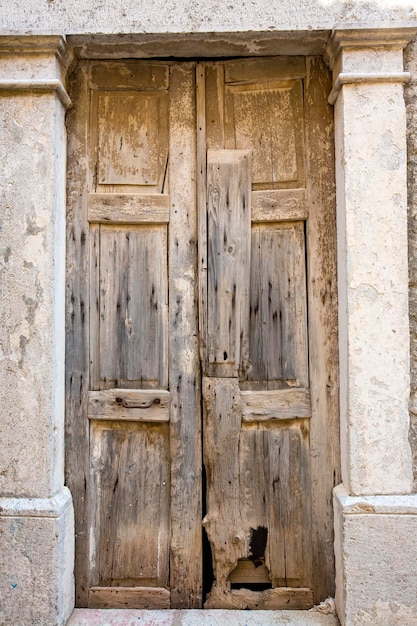 Stare drzwi, drewniane i ścienne tekstury tła