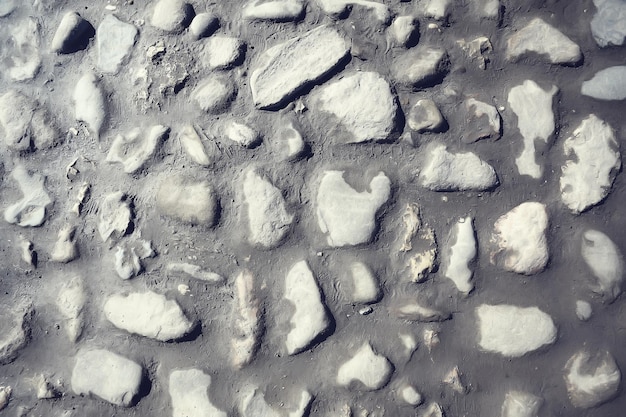 stary kamienny bruk tło / abstrakcyjny bruk, duże kostki brukowe, stara tekstura drogi