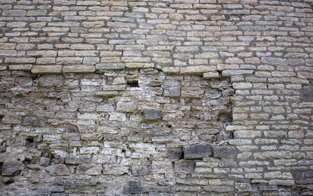 Stary kamienny mur ruiny Starożytna struktura kamieni z pleśnią