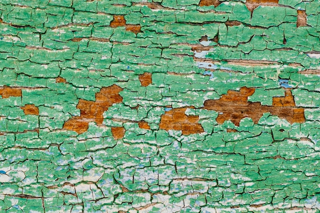 Stary tło zielony pęknięty ściany