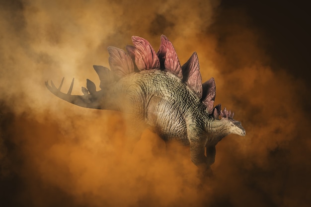 Zdjęcie stegozaur, dinozaur na tle dymu