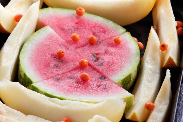 Sterta plasterków arbuza i melona jako tło Zbliżenie świeżego arbuza i melona Wegetariańska zdrowa żywność