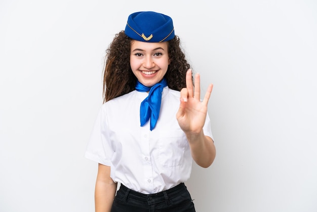 Stewardessa samolotu Arabska kobieta odizolowana na białym tle szczęśliwa i licząca trzy palcami