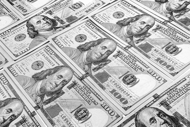 Sto dolarów w tle Duża liczba rachunków Banknoty w dolarach amerykańskich Tekstura pieniędzy