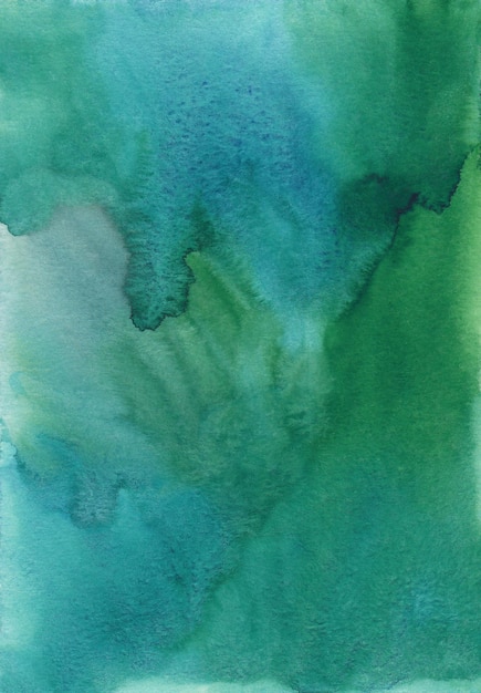 Streszczenie tekstura tło zielony akwarela, ręcznie malowane. Artystyczny szmaragdowy kolor tła, plamy na papierze. Morska zielona tapeta do malowania akwareli.