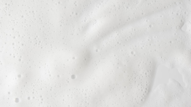 Zdjęcie streszczenie tło biała pianka mydlana tekstura szampon pianka z bąbelkami