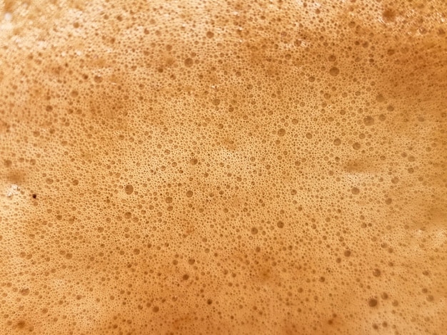 Streszczenie zbliżenie fotografii bąbelków gorącej kawy latte tła i tekstur