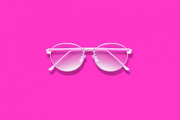 Stylowe różowe okulary na różowej powierzchni