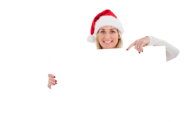 Świąteczna blondynka pokazuje białego plakat