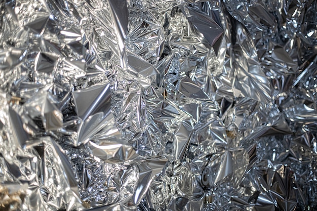 Świąteczna błyszcząca srebrna folia tekstury tła makro