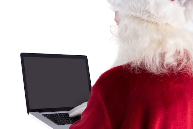 Święty Mikołaj używa laptopa