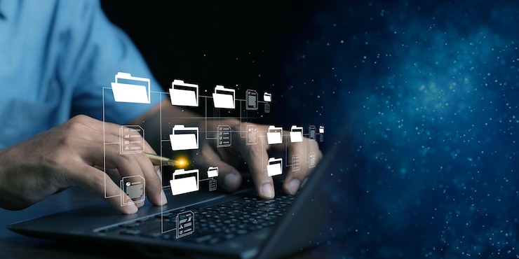 Zdjęcie system zarządzania dokumentami dms konfigurowany przez konsultanta it pracującego na laptopie w biurze z katalogiem dokumentów oprogramowanie do archiwizacji wyszukiwania i zarządzania informacjami o plikach korporacyjnych
