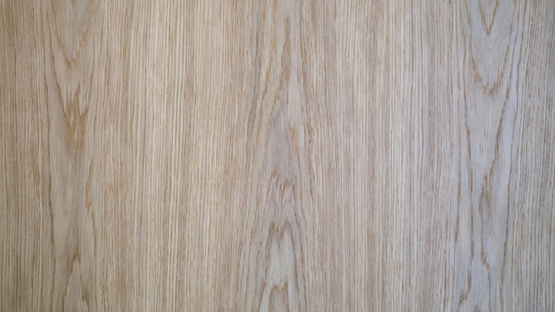 Szara, brązowa powierzchnia drewnianej deski z laminatu i zbliżenie tła parkietu