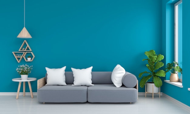Szara sofa i stół w niebieskim salonie