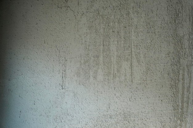 Szara, szorstka powierzchnia ściany betonowej