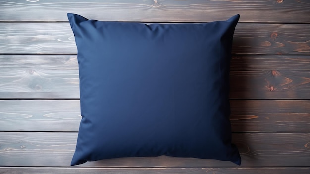Zdjęcie szczegółowe makety niebieskiej poduszki na drewnianej powierzchni