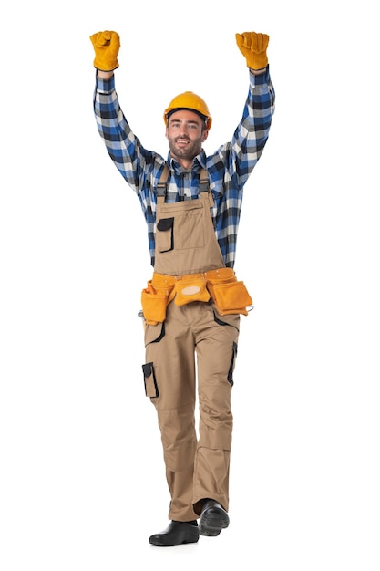 Szczęśliwy pracownik budowlany z podniesionymi rękami