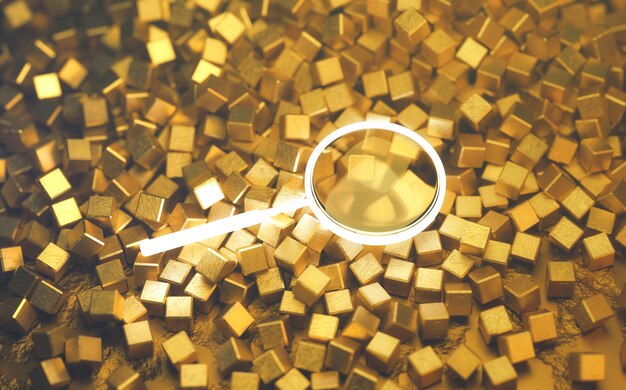 Zdjęcie szkło powiększające umieszczone na stosie złotej kostki