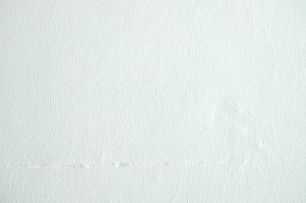 Zdjęcie szorstki biały relief sztukaterie ściany tekstury tła puste dla designerlight ściany białego cementu