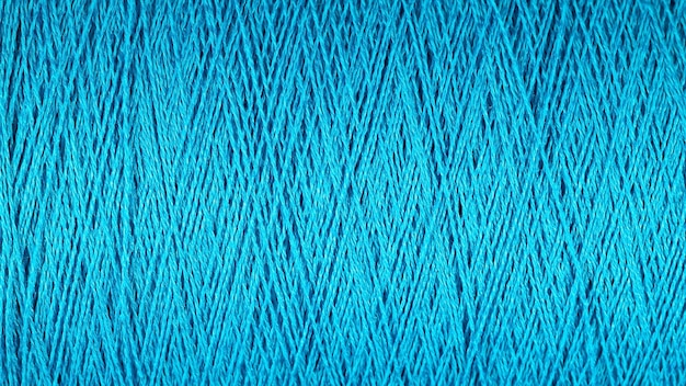 Szpula tekstury tła makro niebieskiej nici