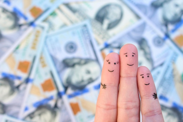 Zdjęcie sztuka palców rodziny na tle pieniędzy