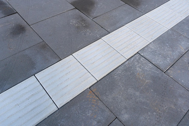 Tactile Paving on Modern Tiles Pathway for Blind Handicap Safety Sidewalk Walkway for Disability People Relief Slab Sidewalk Pathway Brick Path Road Granite Tiles Walkway