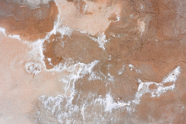Tekstura betonowa ściana może być używana jako tło Fragment ściany z rysami i pęknięciami