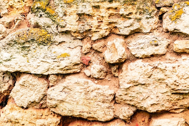 Zdjęcie tekstura, cegła, ściana, może służyć jako tło. tekstura cegły z rysami i pęknięciami