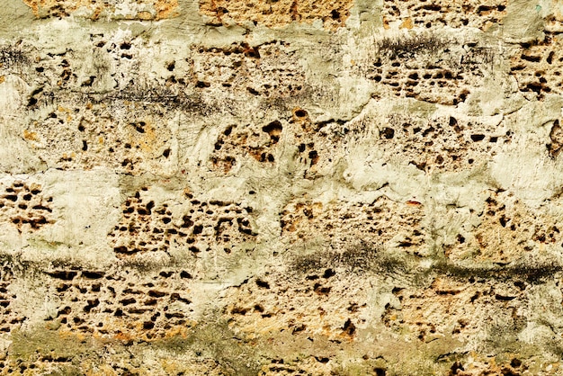 Tekstura, cegła, tło ściany. Tekstura cegły z rysami i pęknięciami