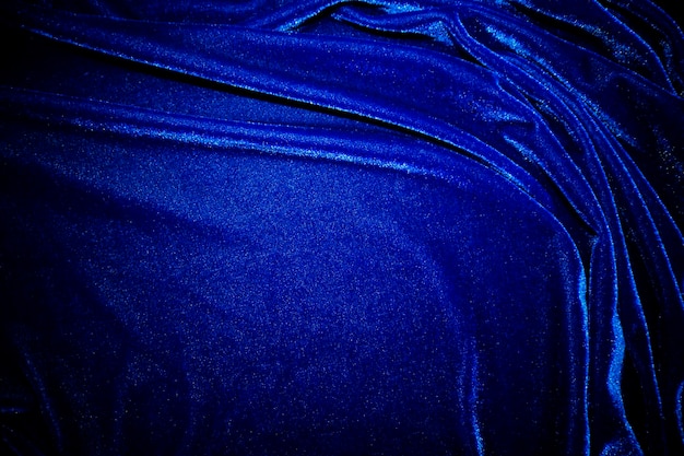Tekstura ciemnej aksamitnej tkaniny użyta jako tło Tkanina panne koloru niebieskiego tło miękkiego i gładkiego materiału włókienniczego tłoczony aksamit luksusowy odcień kobaltowy dla jedwabiu x9
