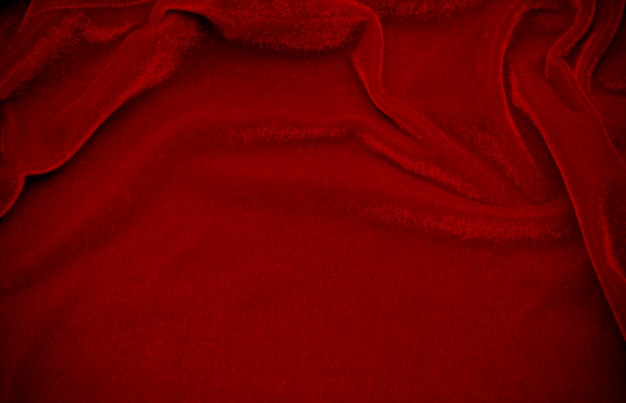 Zdjęcie tekstura czerwonego aksamitu używana jako tło puste czerwone tło tkaniny z miękkiego i gładkiego materiału tekstylnego jest miejsce na tekst