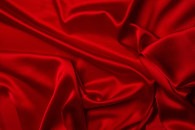 Tekstura czerwonego jedwabiu lub satyny luksusowej tkaniny może służyć jako abstrakcyjne tło Widok z góry