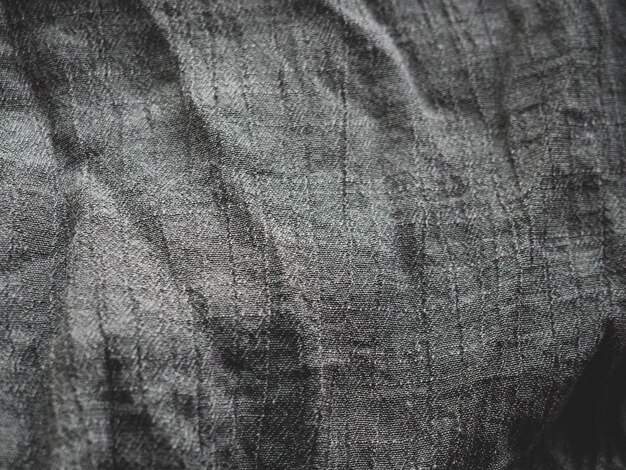 Zdjęcie tekstura dzianiny. zbliżenie zmiętej tkaniny z miejscem na tekst