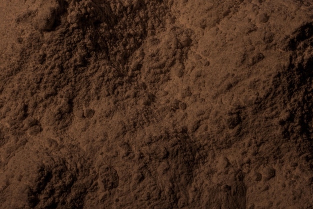 Tekstura glinianego piasku ziemi Brown tło