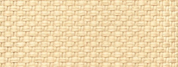 Tekstura jasnego beżowego tła z tkanego materiału włókienniczego z makrom wzorem wióru