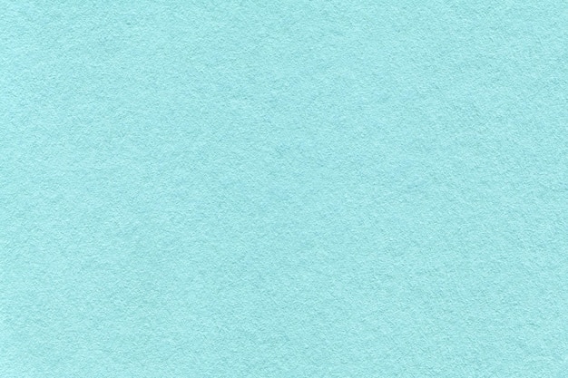 Tekstura jasnoniebieskich i turkusowych kolorów papieru tła makro Struktura gęstej tektury cerulean rzemieślniczej