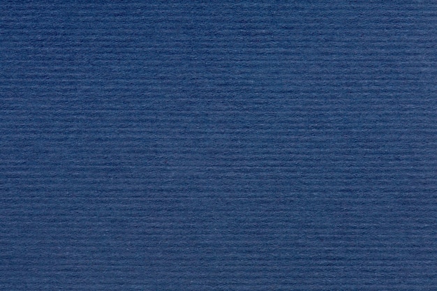 Tekstura niebieskiego koloru szczotkowanego arkusza papieru dla pustych i czystych środowisk