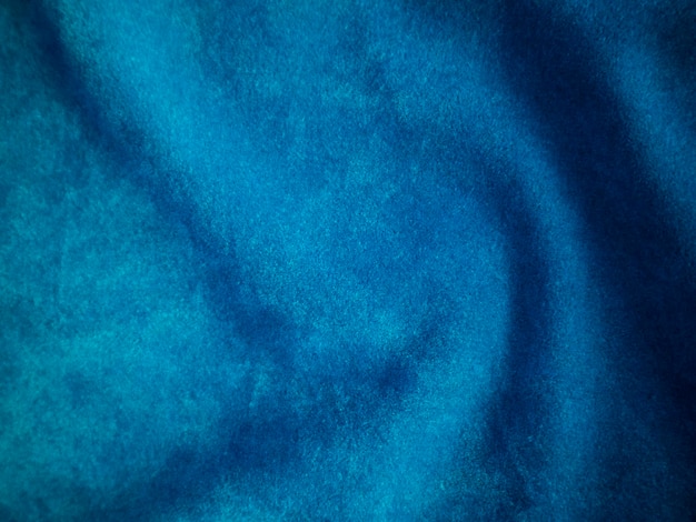 Tekstura niebieskiej aksamitnej tkaniny używana jako tło Puste niebieskie tło tkaniny z miękkiego i gładkiego materiału tekstylnego Jest miejsce na tekstx9
