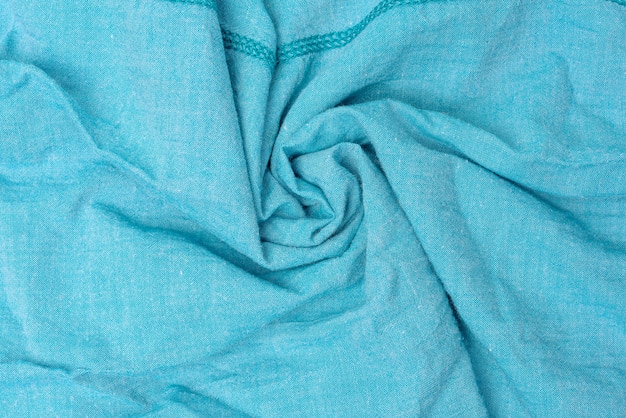 Tekstura niebieskiej tkaniny bawełnianej, skręcona tkanina, pełna klatka