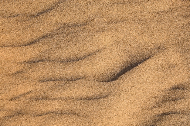 Tekstura piasku na pustynnym tle zbliżenia Wydma z wzorem fal piasku