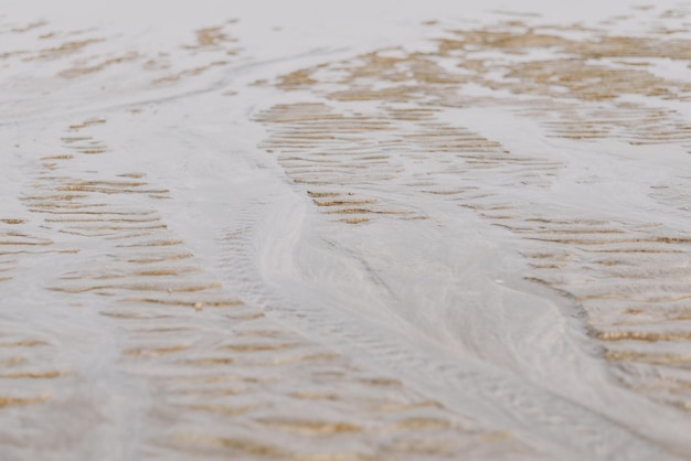 Zdjęcie tekstura piasku plaży plaża podczas odpływu tło plaży