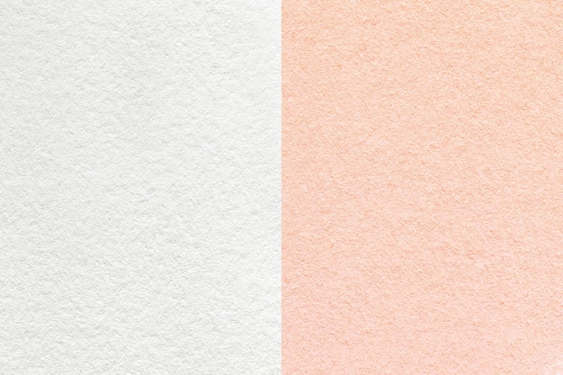 Tekstura rzemieślniczego białego i różowego papieru tła pół dwóch kolorów makro Struktura rocznika gęstej róży perłowej tektury