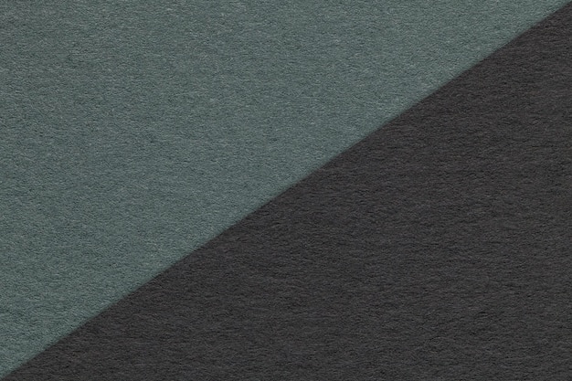 Zdjęcie tekstura rzemiosła czarne i ciemnozielone tło pół dwa kolory makro vintage gęsty karton kraft turkusowy