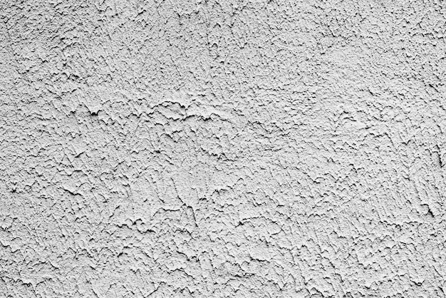 Tekstura, ściana, beton. Fragment ściany z rysami i pęknięciami